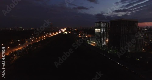 4K night aerial video of Kutuzovskiy Avenue highway at Victory Park and memorial complex in Poklonnaya Hill, near Moscow River in Moscow, Russia