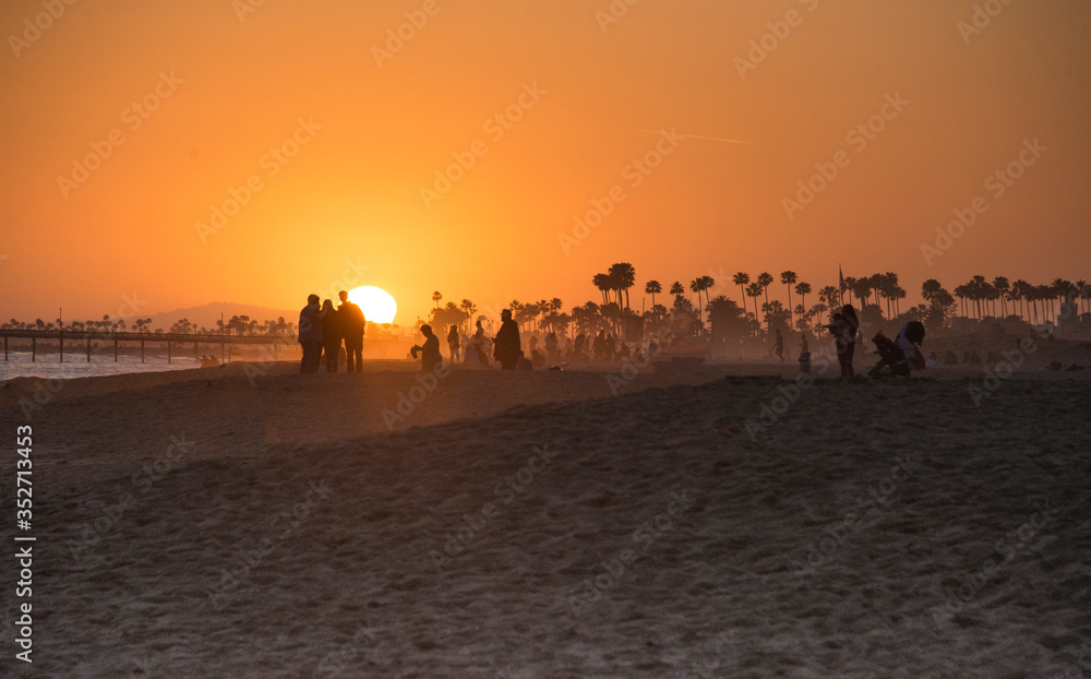 sunset at the beach during the time of social distancing
