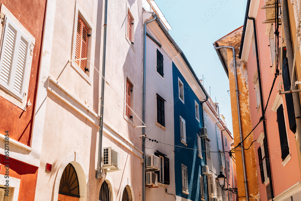 Old town narrow alley with colorful buildings in Piran, Slovenia