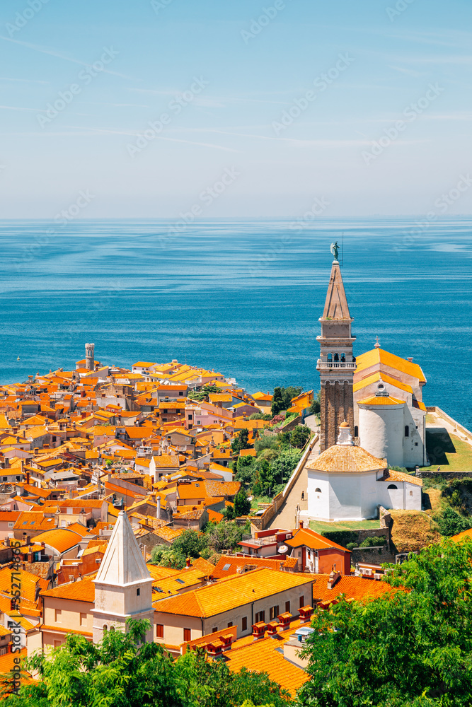Panoramic view of Piran old town and Adriatic sea with St. George's Parish Church in Slovenia