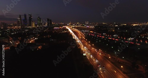 Victory Park 4K night aerial video with background view of Moscow City Business Center, Kutuzovskiy Avenue busy road traffic, memorial complex in Poklonnaya Hill, near Moscow River in Moscow, Russia