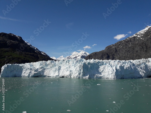 Alaska glacier, lake, canal, mountains and snow with a clear blue sky on a sunny spring day 2018 © CURTIS