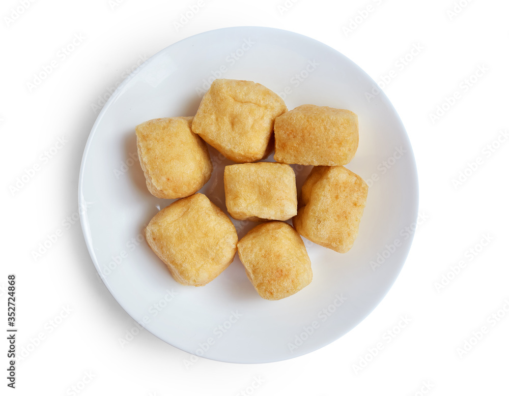 Top view of brown tofu puff with plate isolated on white. Top view of brown tofu puff with plate isolated on white.