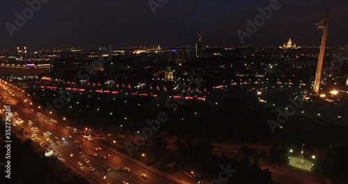 Victory Park 4K night aerial video with background view of Moscow City Business Center, Kutuzovskiy Avenue busy road traffic, memorial complex in Poklonnaya Hill, near Moscow River in Moscow, Russia
