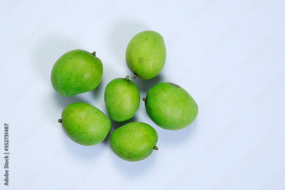 Fresh ripe green color mangoes isolated on white background Fresh ripe green color mangoes isolated on white background