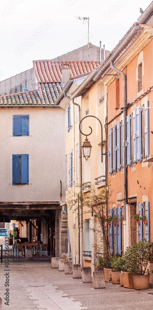 Fototapeta premium Deserted street of the old european city at sunset