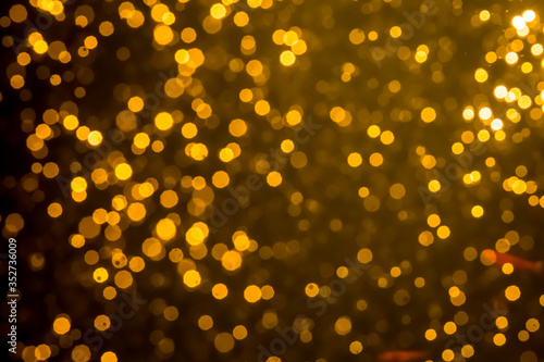 Golden blur glitter lights abstract bokeh for Merry Christmas and New Year