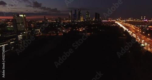 4K night aerial video of Kutuzovskiy Avenue highway at Victory Park and memorial complex in Poklonnaya Hill, near Moscow River in Moscow, Russia