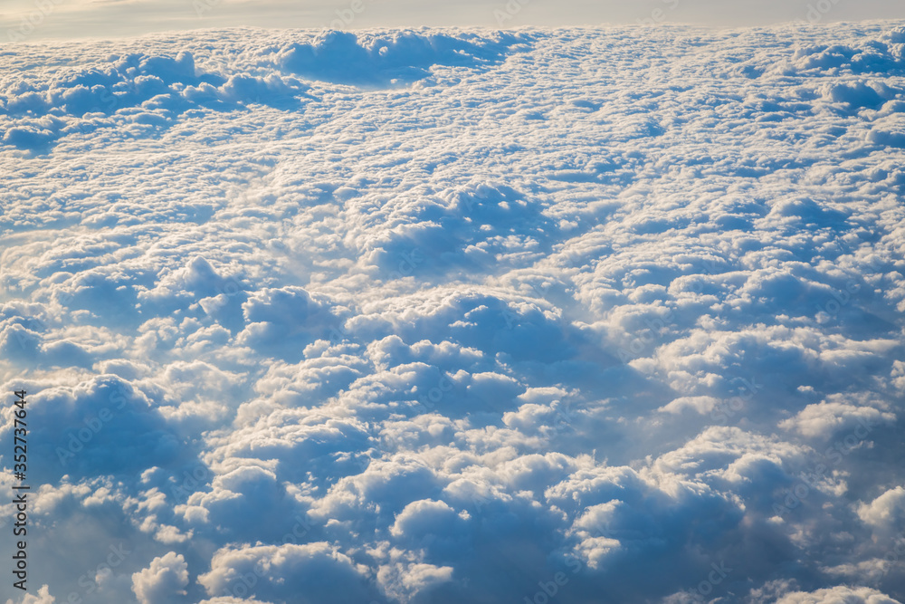 Naklejka premium Sky and clouds from above the ground viewed from an airplane