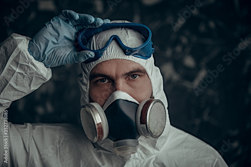 bacteriologist in respiratory mask photo