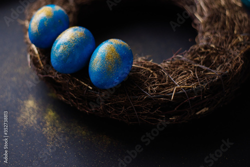 blue easter eggs in a nest