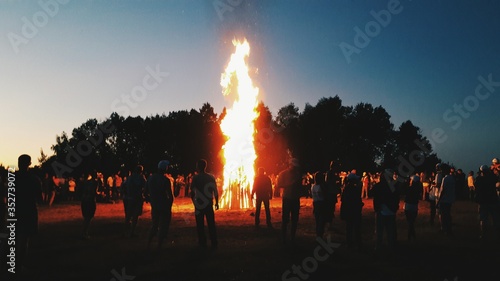 Fotografie, Obraz Large Bonfire Surrounded By People