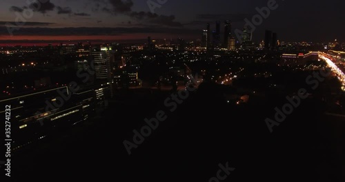 Victory Park 4K night aerial video with background view of Moscow City Business Center, Kutuzovskiy Avenue busy road traffic, memorial complex in Poklonnaya Hill, near Moscow River in Moscow, Russia