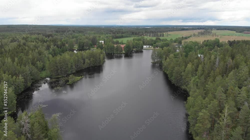 Aerial view of lake Nedre Dammen in Gammelstilla, Gästrikland, Sweden with the small island outside Skoludden. Aerial view of lake Nedre Dammen in Gammelstilla, Gästrikland, Sweden with the small island outside Skoludden.