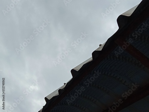 shadow of the metal roof in the sky