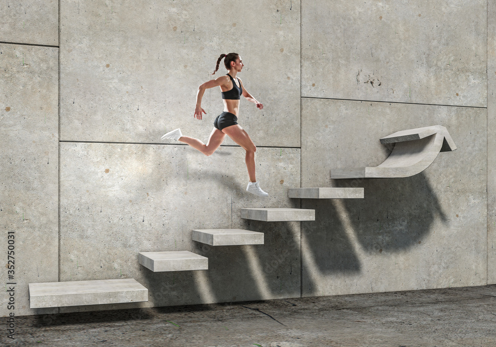 Fototapeta premium Image of sport woman walking upstairs