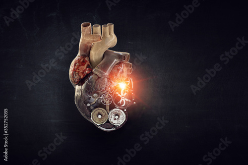 Image of human heart made of metal elements photo