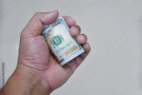 Dollars bills in hand. Texture background American bills money dollars in hand. Image of money 100 us dollars in hand. Exchange rate concept.