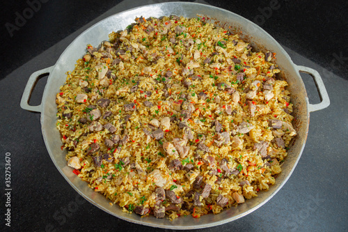 Mixed rice with meat Paella On a rice pot