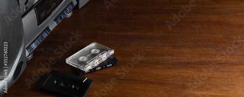 Wallpaper Mural Old audio cassettes and a player on a wooden table. Copy space for text or design Torontodigital.ca