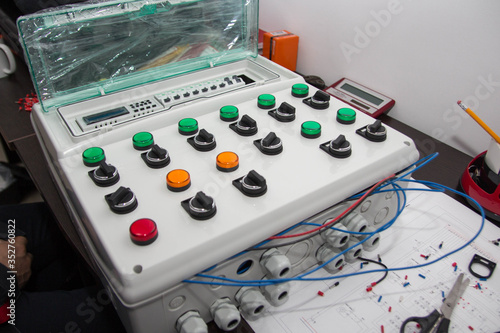 Assembly of the automatic control panel. Information technology. Technology electrotechnical design. Modern engineering, futuristic, science communication concept. Digital technology background