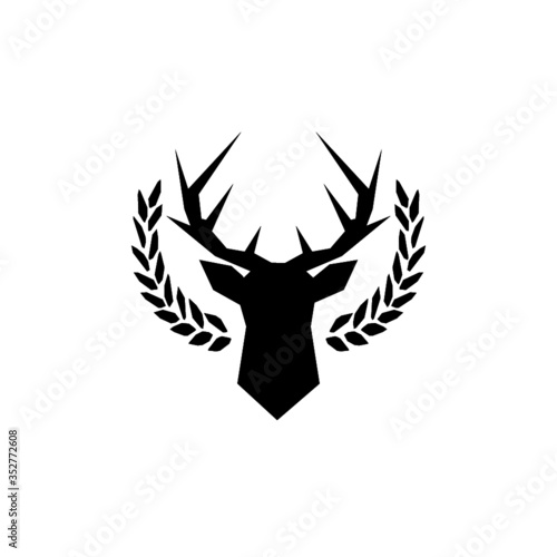 Hunting trophy. Deer head with big antlers in laurel wreath isolated on white background