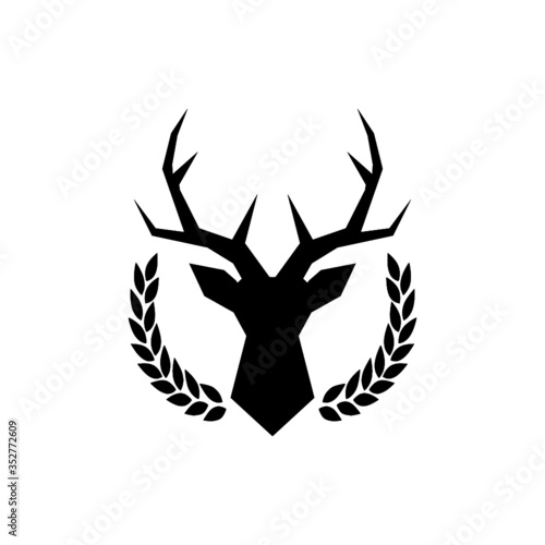 Hunting trophy. Deer head with big antlers in laurel wreath isolated on white background