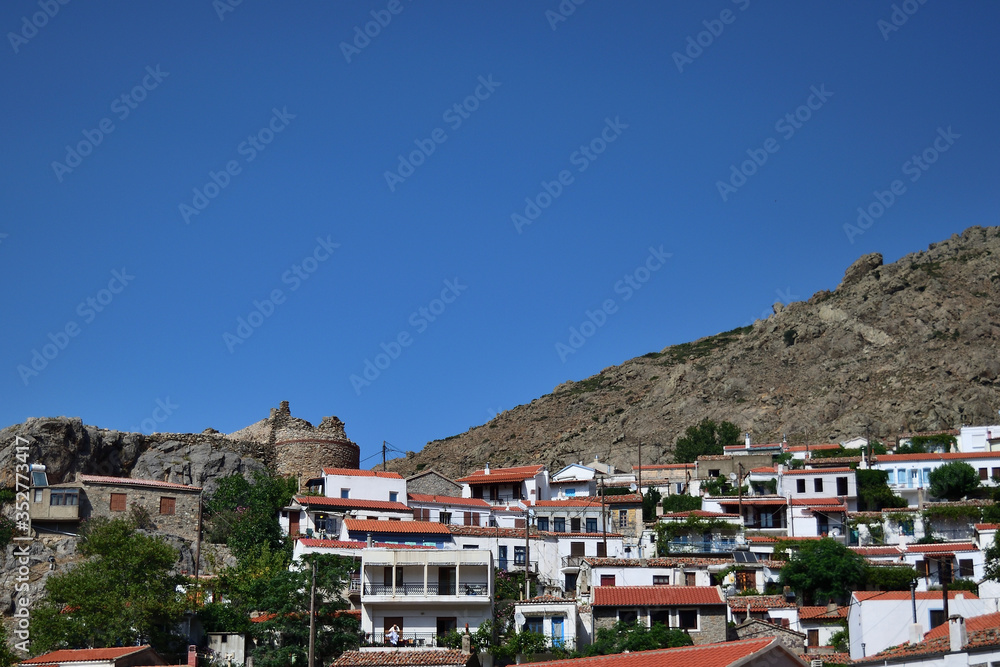 traditional houses and old castle in the Chora town - capital town of aegean Samothraki island, Greece, Aegean sea