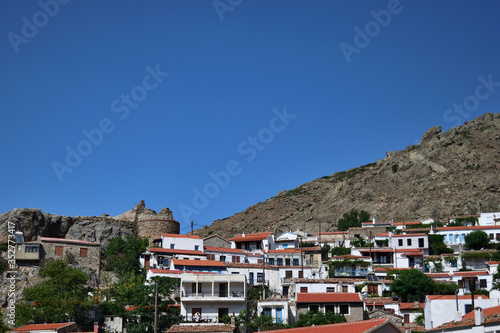 traditional houses and old castle in the Chora town - capital town of aegean Samothraki island, Greece, Aegean sea