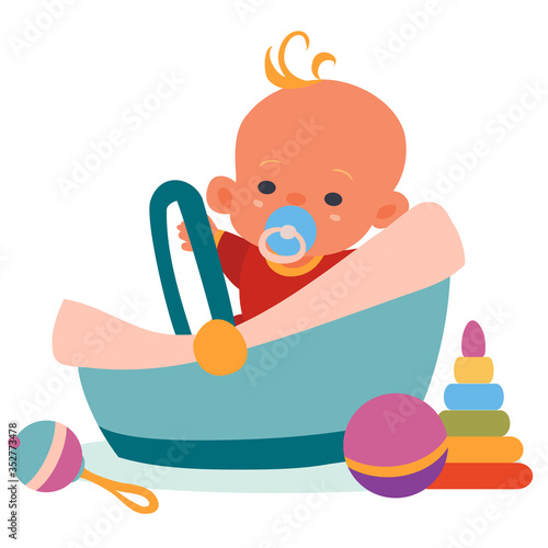 the child sits in a carrier, toys lie around, a rattle, a pyramid, a ball, an isolated object on a white background, vector illustration,