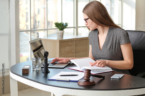 Female lawyer working in of...