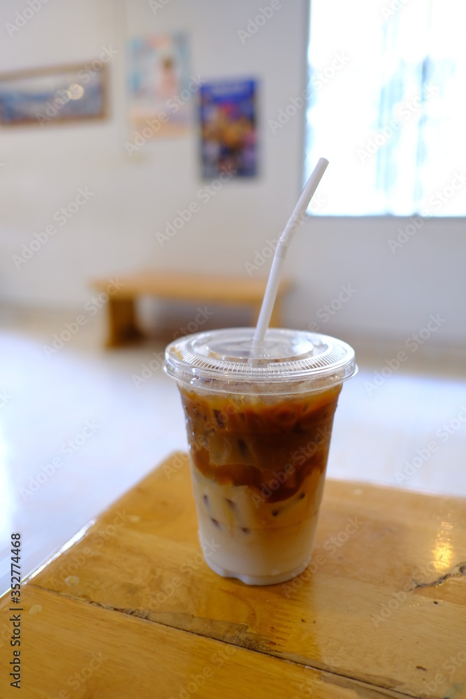 iced caramel macchiato on the table iced caramel macchiato on the table