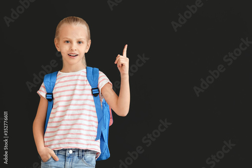 Cute little schoolgirl with...