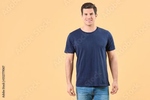 Man in stylish t-shirt on c...