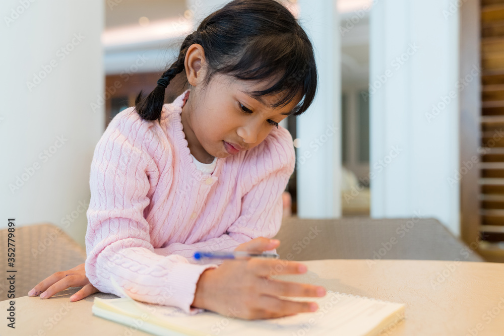 Kid girl draw on book Kid girl draw on book