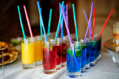 Several colorful alcohol shots on the table