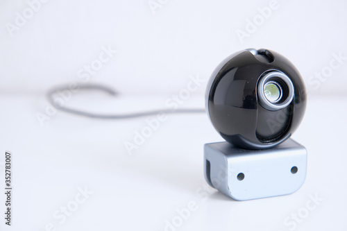 Webcam standalone closeup on white background for covert surveillance of the house. Surveillance and security systems. Smart House. Espionage. Hidden camera for watching