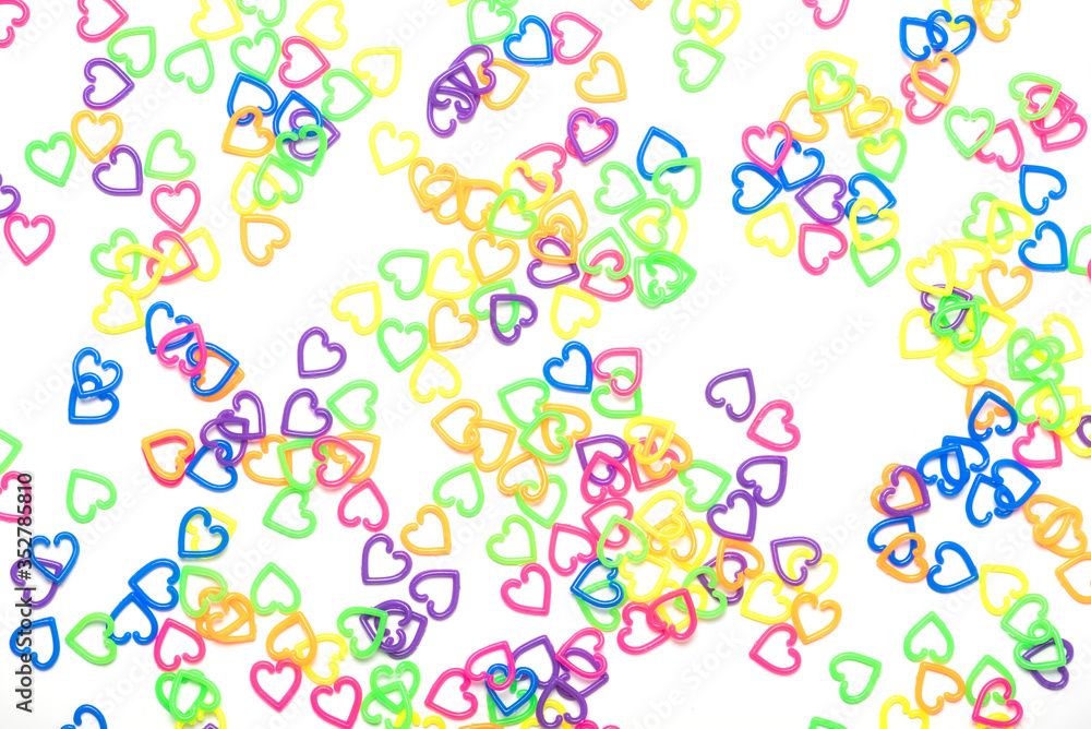 many color plastic heart shape as background , toy for child many color plastic heart shape as background , toy for child