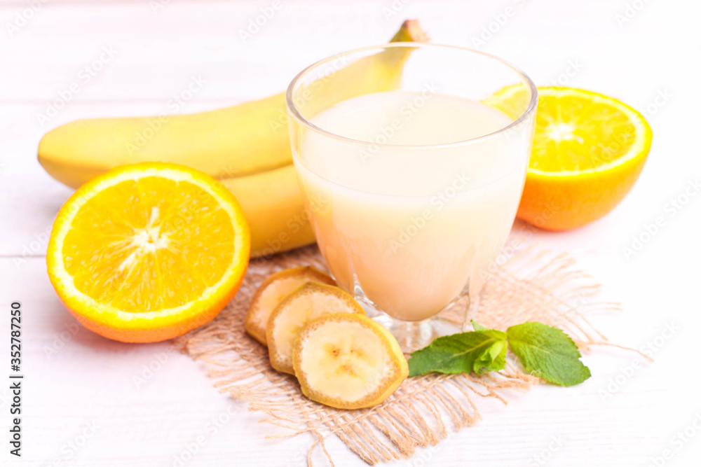 Banana juice in a glass with fruits Banana juice in a glass with fruits