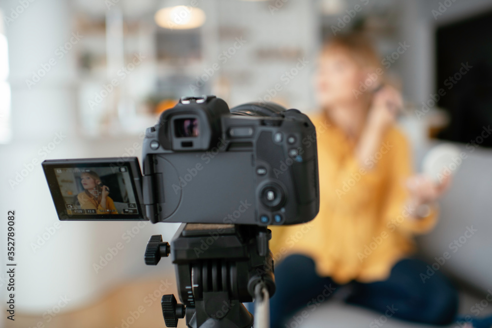 Female vlogger recording makeup tutorial for her channel. Young beautiful woman recording make up tutorial to share on social media. Female vlogger recording makeup tutorial for her channel. Young beautiful woman recording make up tutorial to share on social media.