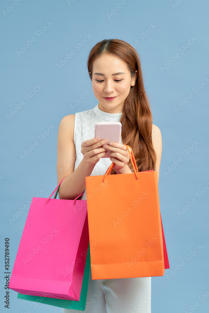 Beautiful young woman using a mobile phone Beautiful young woman using a mobile phone