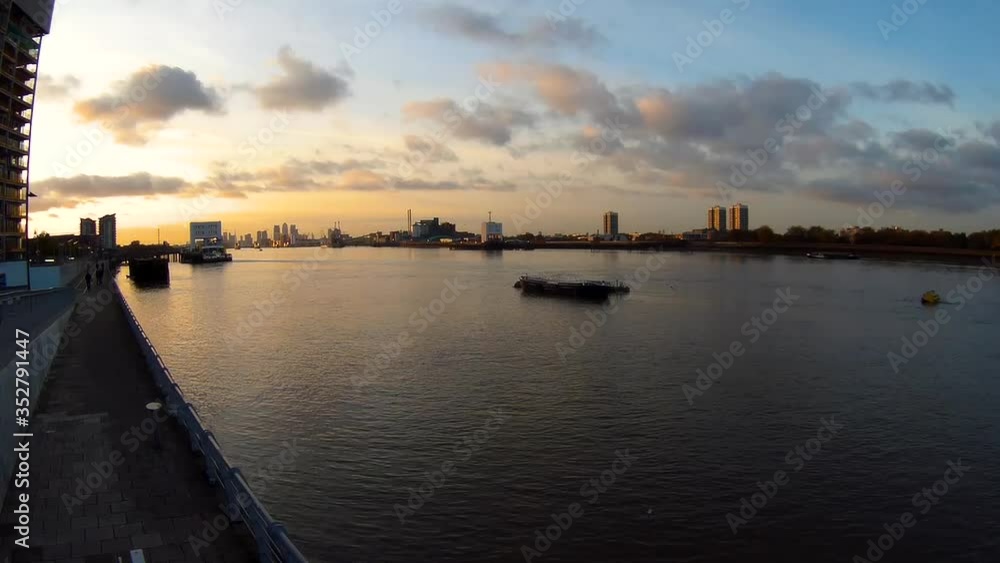 Timelapse - sunset over the Thames river in a district of southeast London (Woolwich) Timelapse - sunset over the Thames river in a district of southeast London (Woolwich)
