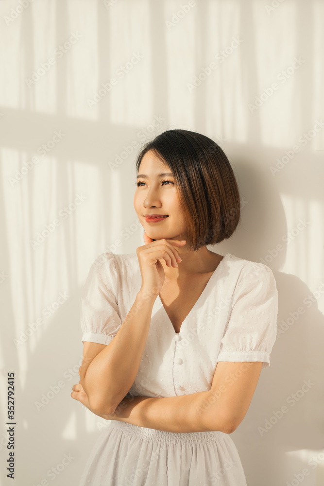 Beautiful young Asian woman sunlight and light clothes Beautiful young Asian woman sunlight and light clothes