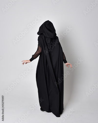 Bild auf Leinwand fantasy portrait of a woman wearing long black cloak