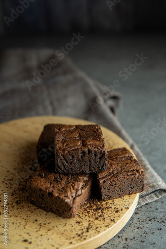 brownies cut in squares. Dark food photography concept