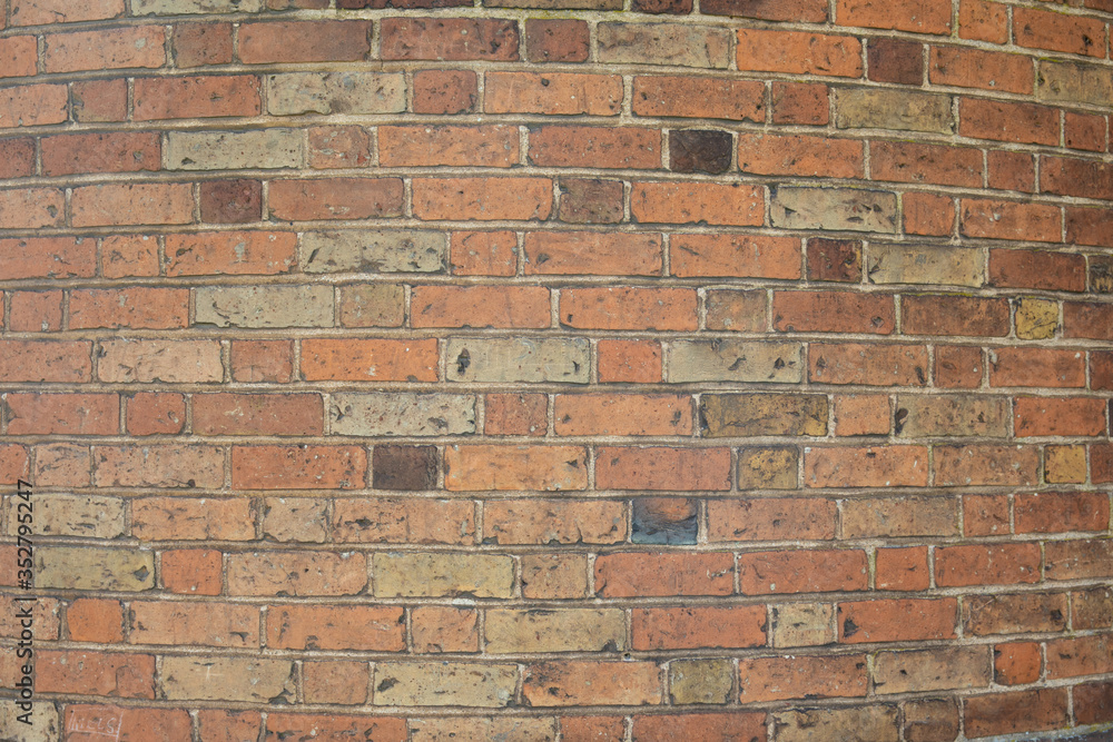 Obraz premium Old brick wall with many different colors of bricks as a background 