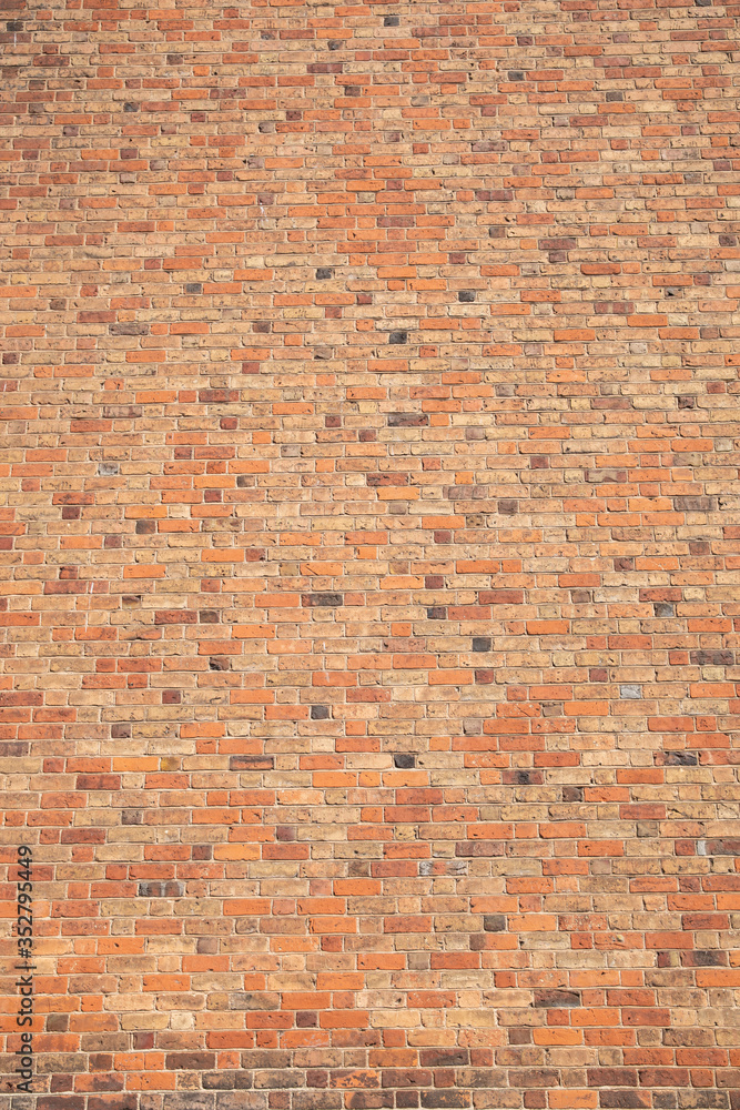 Old brick wall with many different colors of bricks as a background Old brick wall with many different colors of bricks as a background