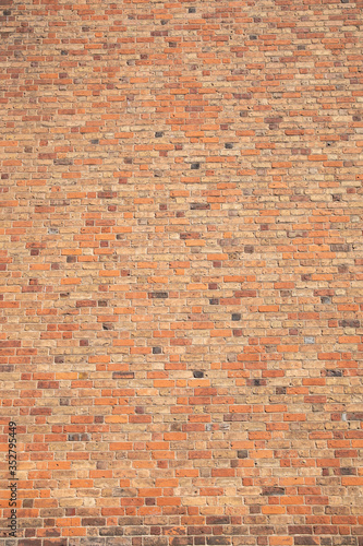 Old brick wall with many different colors of bricks as a background 