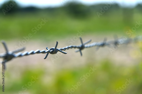 Barbed wire on the edge of a farmers field in York