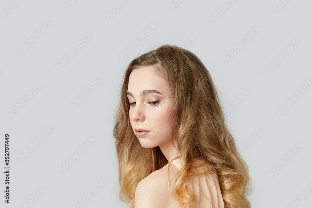 Beautiful blonde girl looks down. Beauty by nature. Beautiful blonde girl looks down. Beauty by nature.